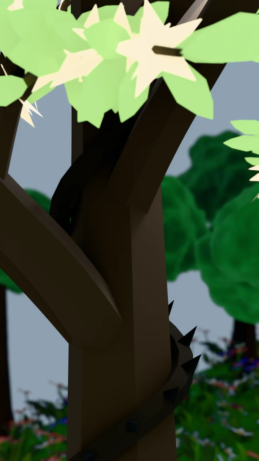Looking up through the branches of the tree at pale leaves against the sky.